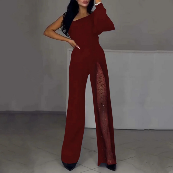 Red one-shoulder flared romper with sheer side panel and wide-leg silhouette