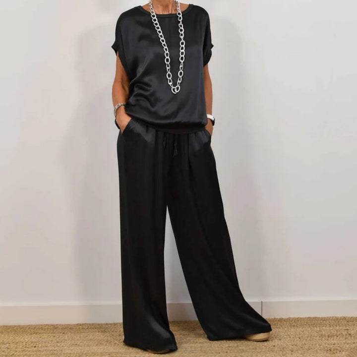 Black flowing blouse and wide-leg pants set with short sleeves, relaxed fit