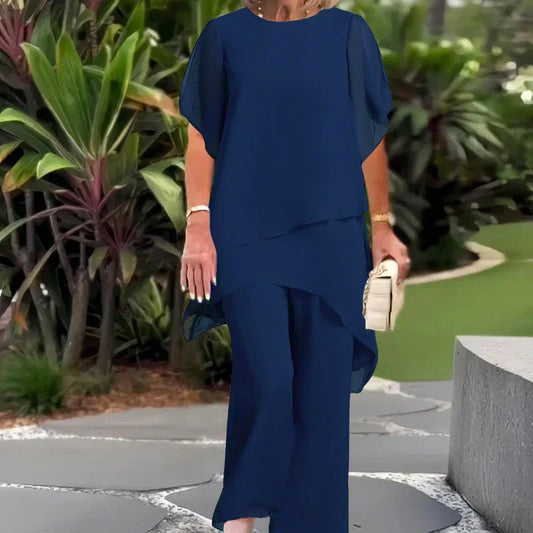 Navy two-piece set with layered short-sleeve top and flowy wide-leg trousers