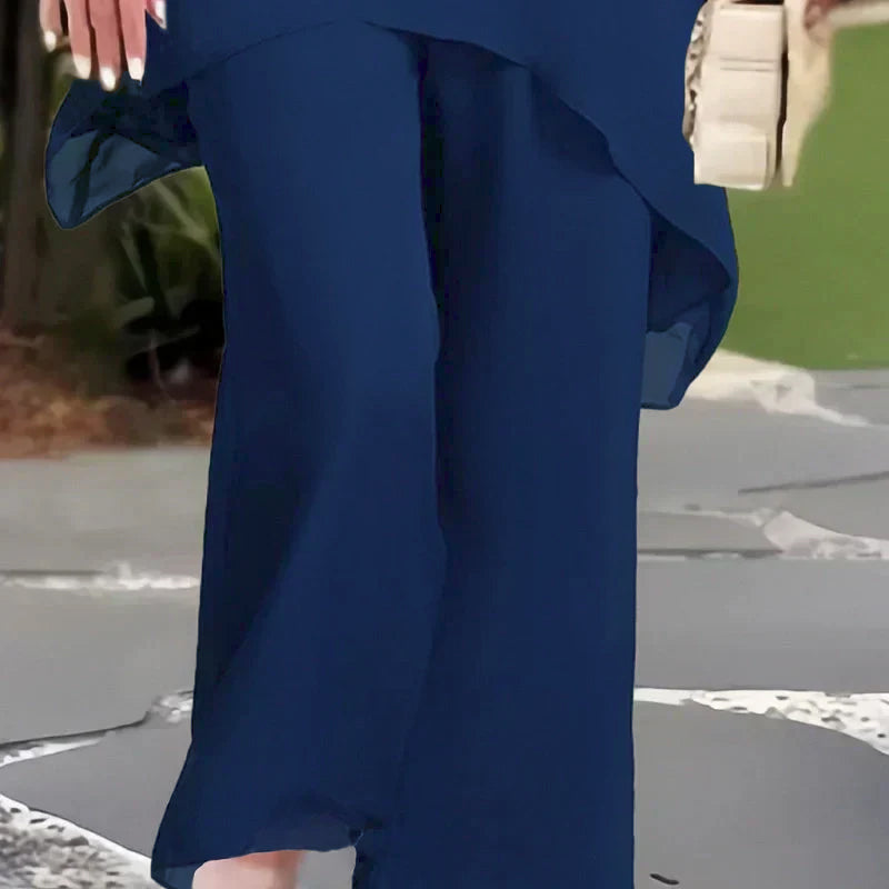 Navy wide-leg trousers with side drape detail, part of a two-piece set