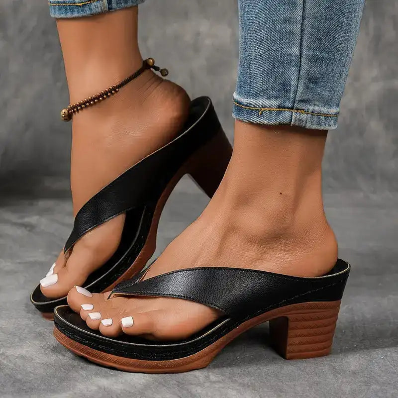 Black thong sandals with textured straps and stacked block heel