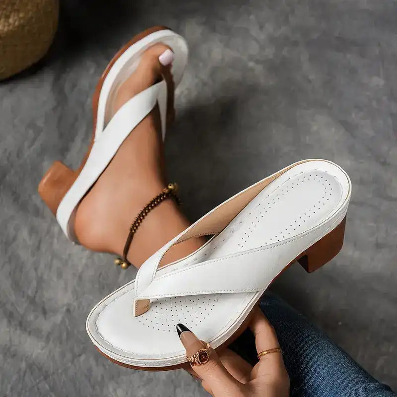 White thong sandals with perforated footbed and chunky block heel