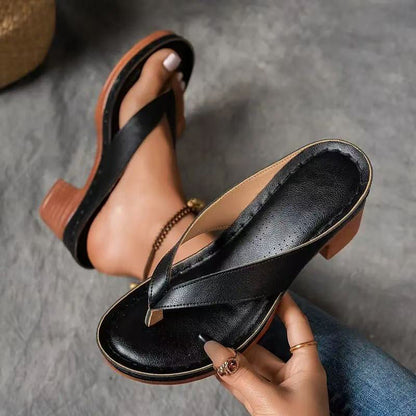 Black thong sandals with textured straps and chunky block heel