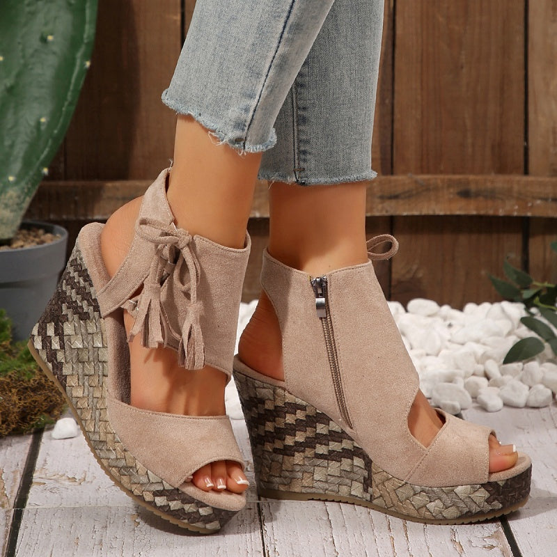 Taupe suede-look ergonomic sandals with tassel laces, ankle zipper, woven wedge heel