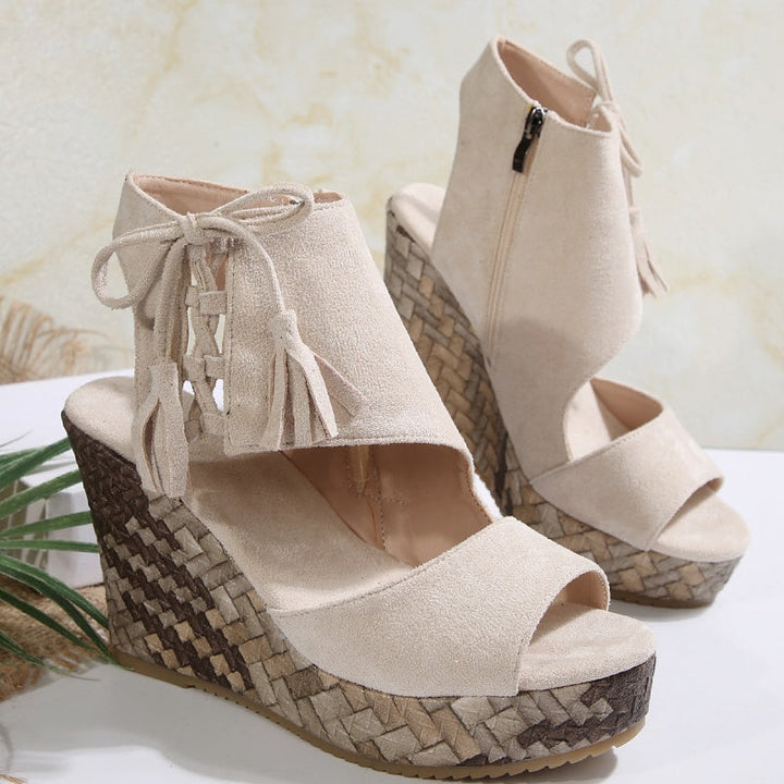 Cream suede-look ergonomic wedge sandals with tassel laces and open toe
