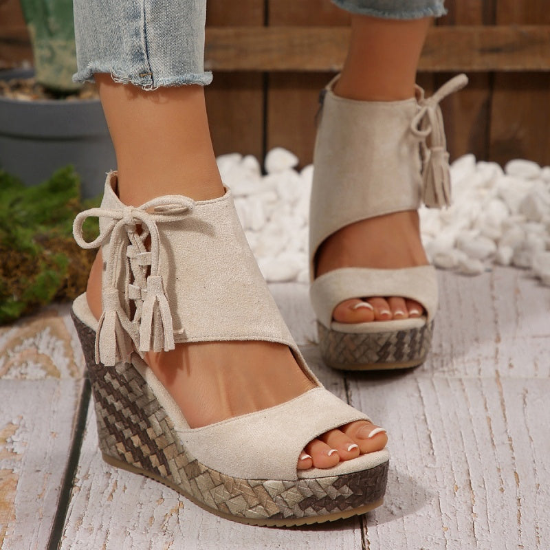 Sand suede-look ergonomic sandals with tassel laces and woven wedge platform