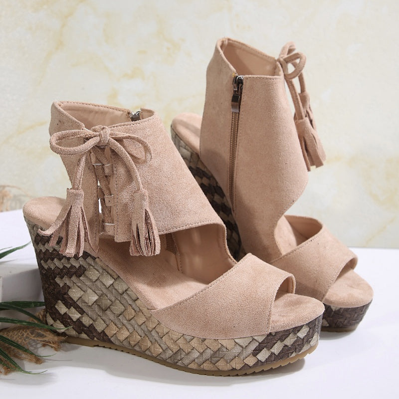Beige suede-look ergonomic sandals with tassel laces, ankle zipper, woven wedge heel