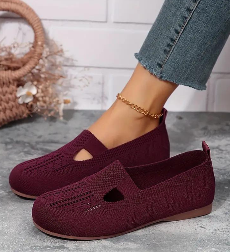 Burgundy knit slip-on sandals with wide strap cutouts and low rubber sole