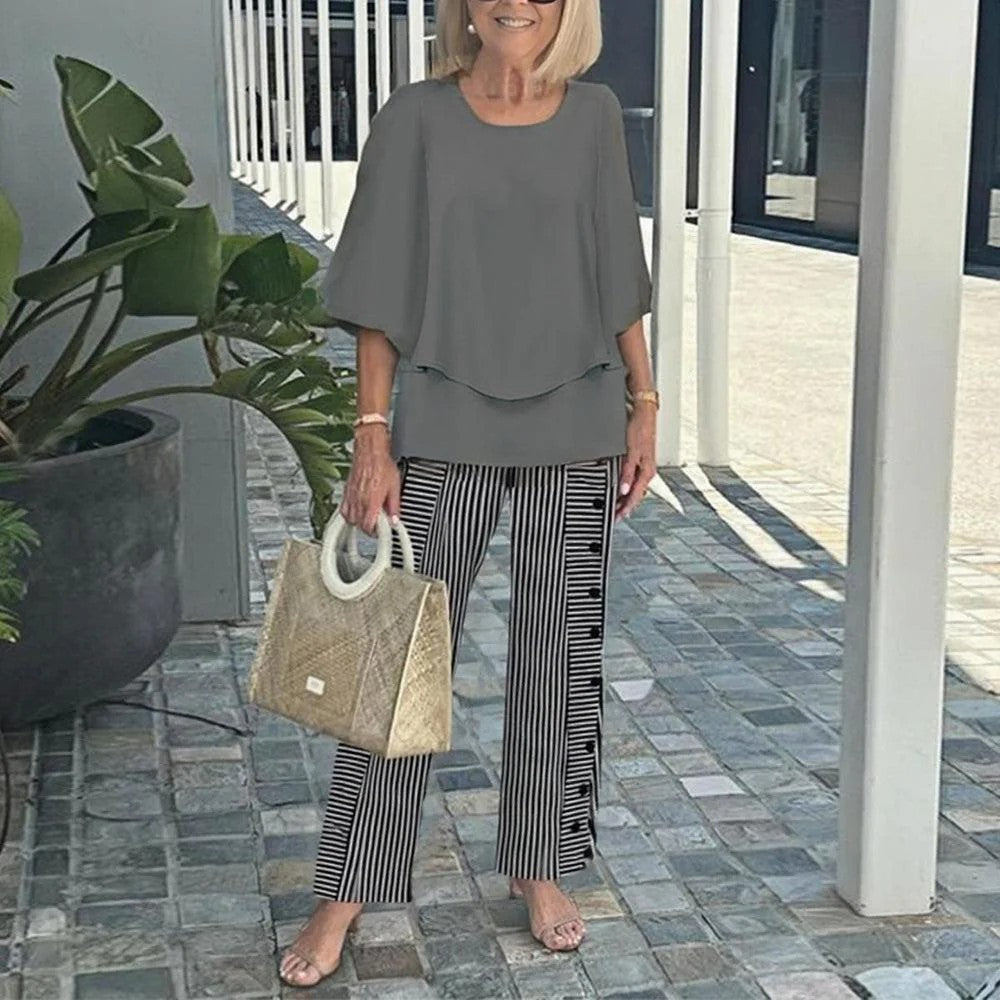 Grey relaxed two-piece set with short-sleeve top and wide-leg striped trousers