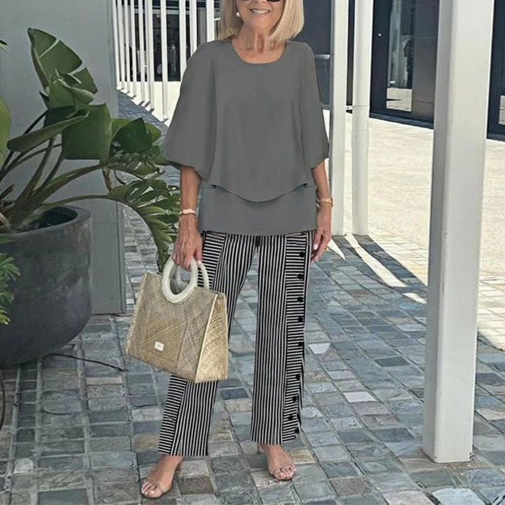 Grey relaxed two-piece set with short-sleeve top and wide-leg striped trousers