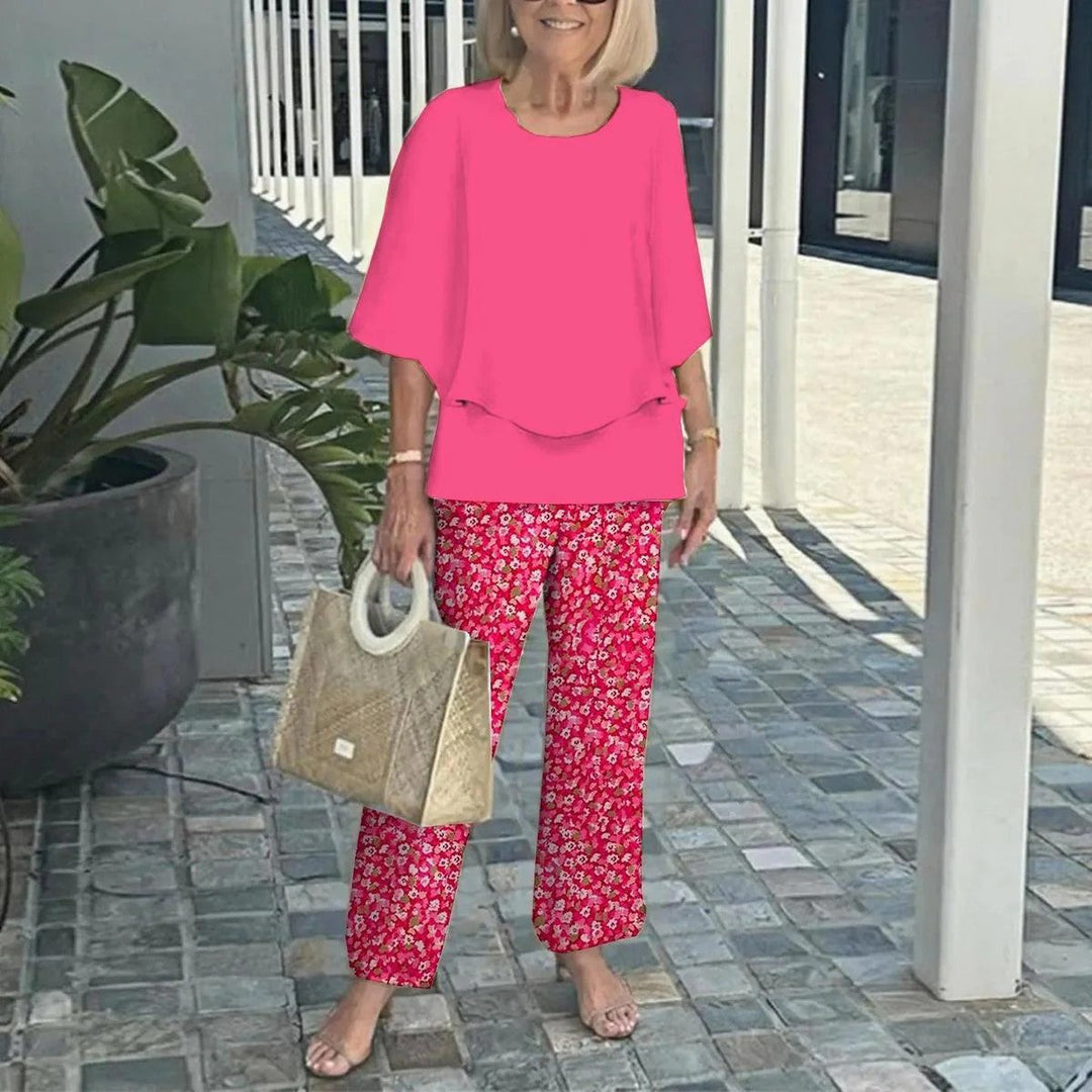 Pink short-sleeve two-piece set with layered-look top and wide-leg floral print trousers