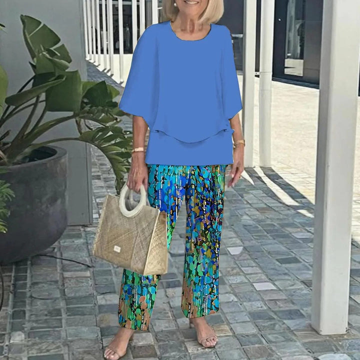 Blue short-sleeve two-piece set with layered-look top and wide-leg patterned trousers