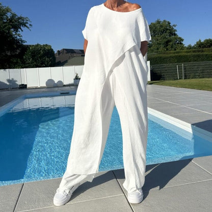 Two-piece set with off-shoulder white top and wide-leg pants, loose drape