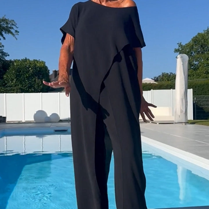Two-piece set with off-shoulder black top and relaxed wide-leg pants, full length
