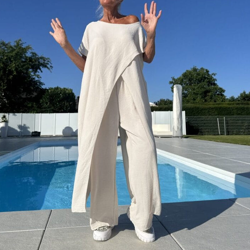 Two-piece set with off-shoulder white top and relaxed wide-leg pants, full length