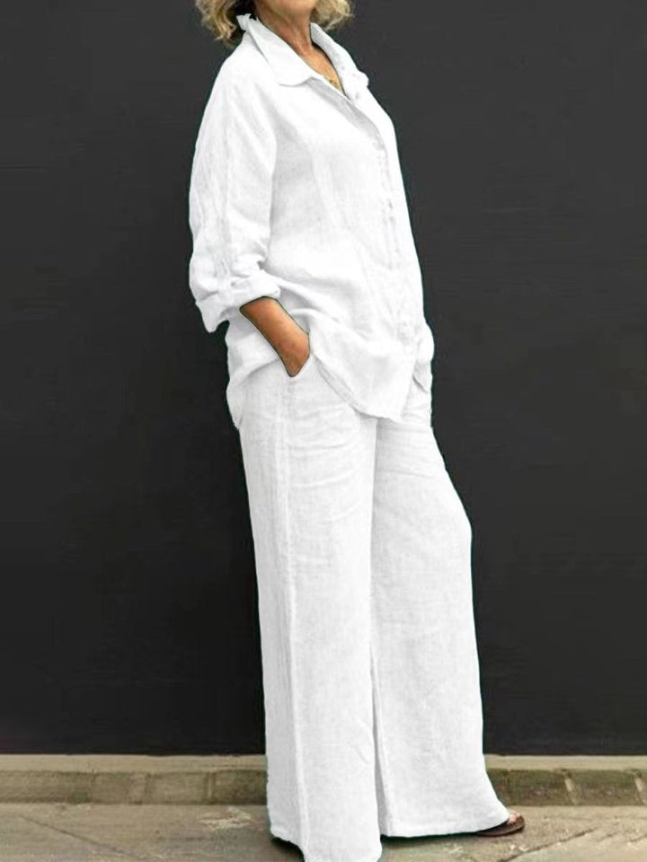 White two-piece set: button-up collared shirt and wide-leg pants with pockets