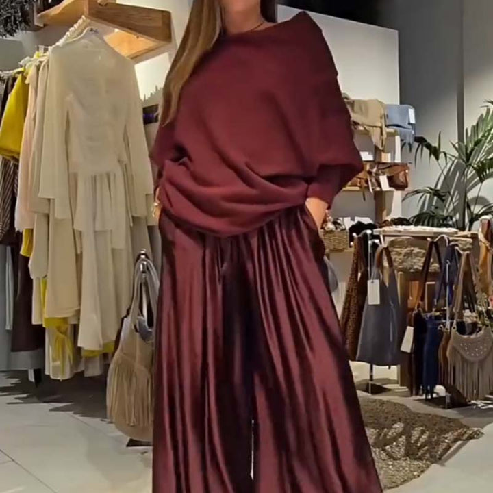 Off-shoulder dress set in deep red with draped cowl top and pleated maxi skirt