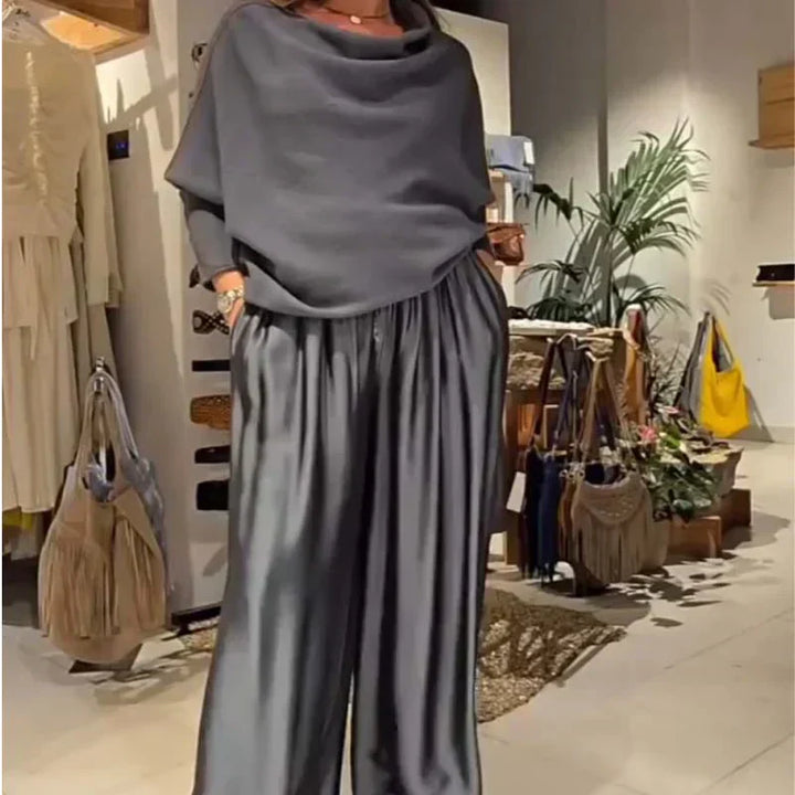 Off-shoulder dress set in grey with draped cowl neckline and pleated maxi skirt