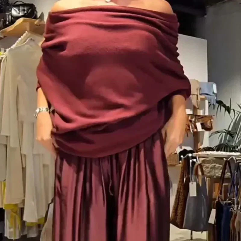Off-shoulder dress set in deep red with draped cowl neckline and gathered pleated skirt