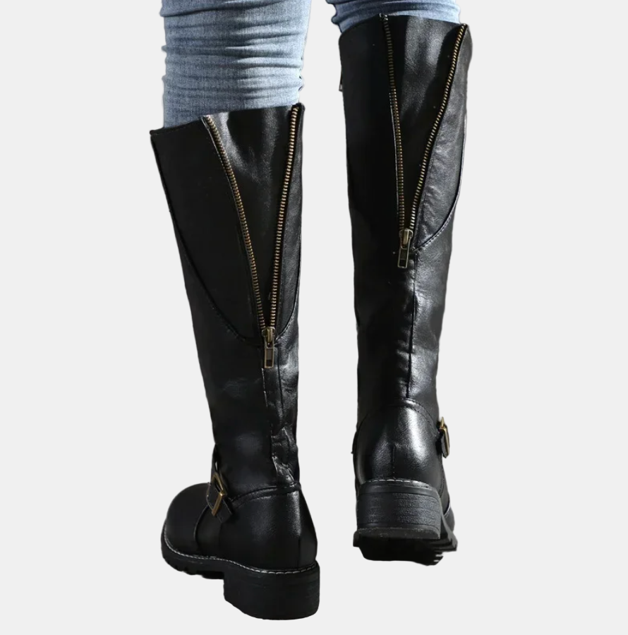 Black tall boots with side zipper and buckle strap detail, chunky sole