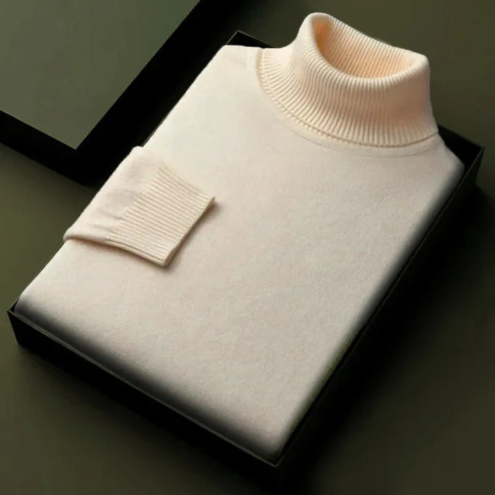 White soft turtleneck sweater, ribbed collar and cuff detail on box fold