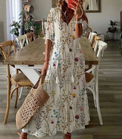 Ivory bohemian maxi dress with short sleeves and delicate multicolor floral stems print.