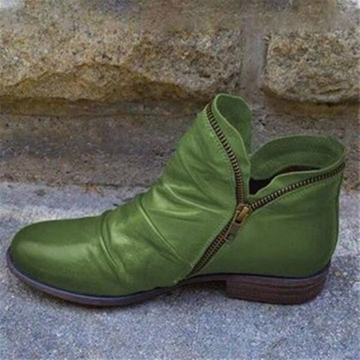 Green leather ankle boots with side zipper and low block heel