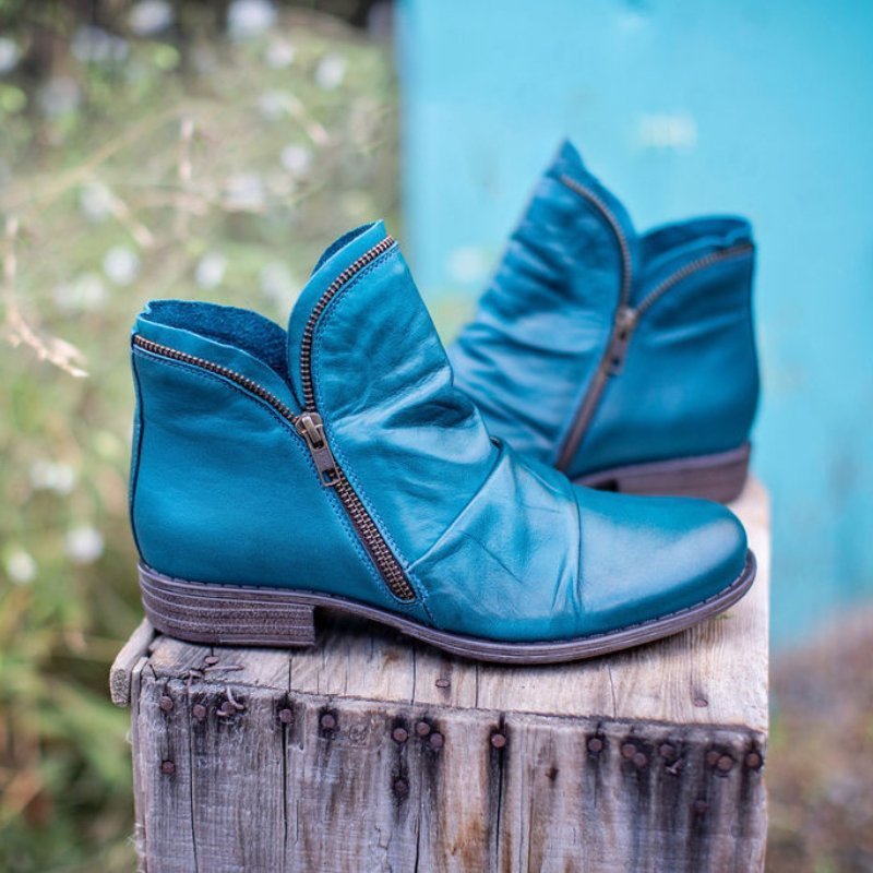 Blue leather ankle boots with side zipper and low block heel