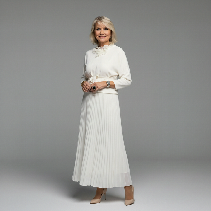 White knit layered dress set with ruffled neck and pleated midi skirt