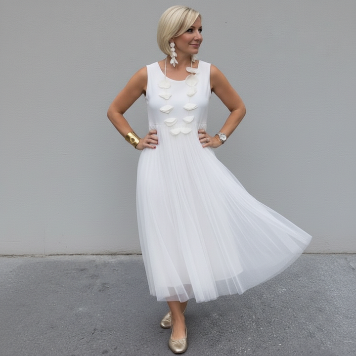 White sleeveless knit dress with 3D flower appliques and pleated tulle hemline