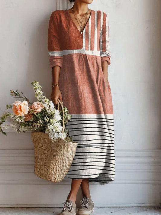 Everyday comfort dress in rust brown with V-neck, three-quarter sleeves, striped hem