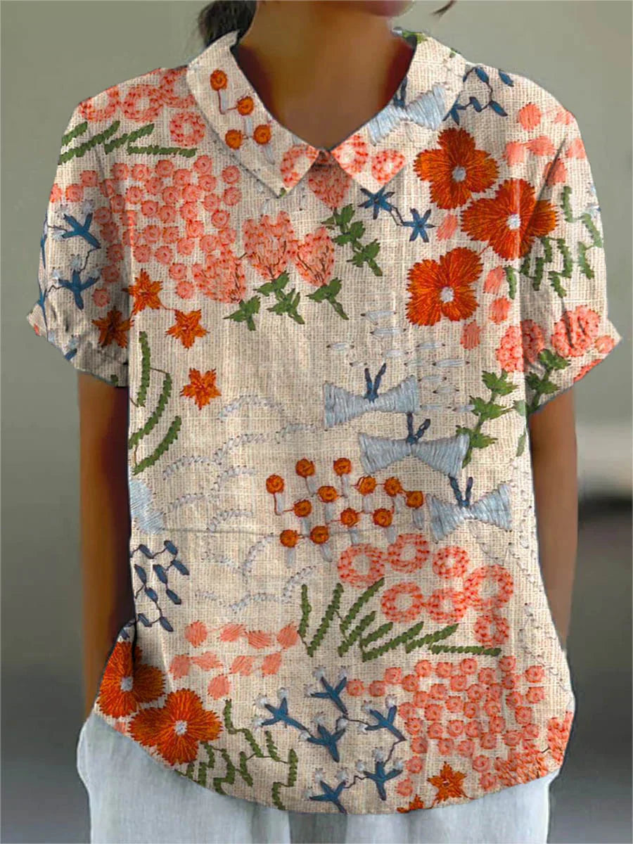 Rustic garden blouse with V-neck, short sleeves, and multicolor floral patchwork print